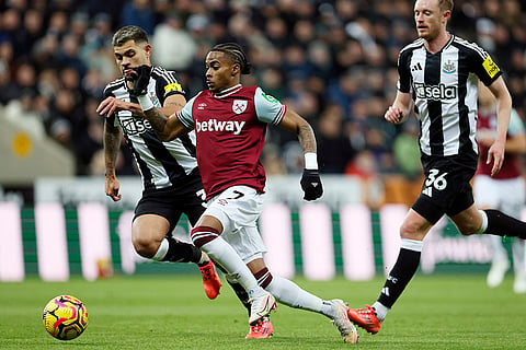 EPL 2024-25: West Ham United's Crysencio Summerville, center, and and Newcastle United's Bruno Guimaraes, left, challenge for the ball