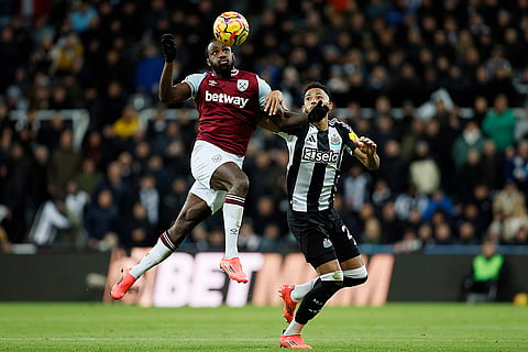 EPL 2024-25: West Ham United's Michail Antonio, left, and Newcastle United's Lloyd Kelly, right, challenge for the ball