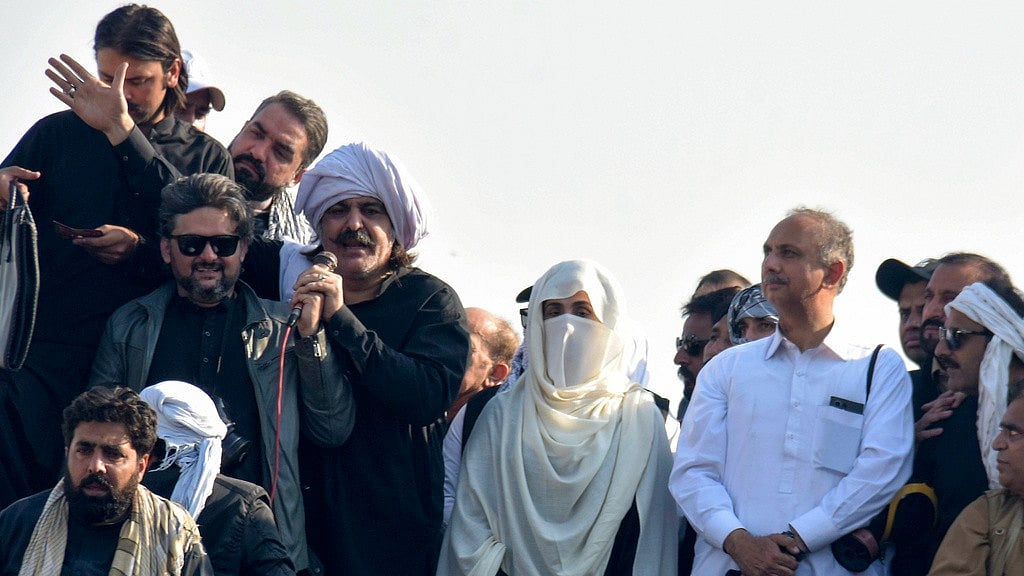 AP/W.K. Yousufzai : Imran Khan's wife Bushra Bibi, centre, and leaders of Khan's party lead their supporters during a rally demanding Khan's release in Islamabad.