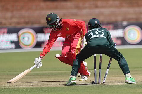 ZIM vs PAK 2nd ODI: Zimbabwe's Tadiwanashe Marumani, back, reaches for the crease in front of Pakistan's wicket keeper