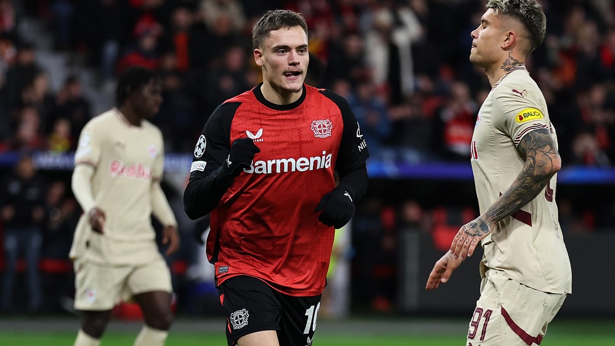 Florian Wirtz celebrates opening the scoring from the spot for Bayer Leverkusen.