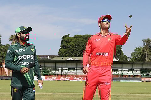 ZIM vs PAK 2nd ODI: Ziumbabwe's Craig Ervine, right, is watched by Pakistan's Mohammad Rizwan, left, during the toss