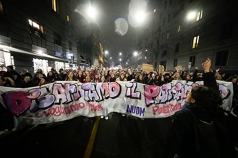 Women attend a rally in Milan, Italy