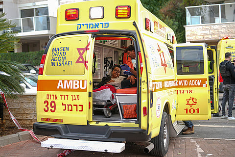 Middle East Tensions: An injured woman sits inside an ambulance in Israel