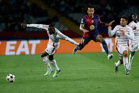 UEFA Champions League: Barcelona's Jules Kounde jumps for the ball