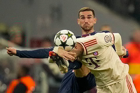 UEFA Champions League: Bayern's Konrad Laimer, front, duels for the ball with PSG's Fabian Ruiz