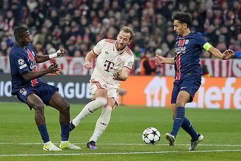 UEFA Champions League: PSG's Willian Pacho, left, tries to block a shot from Bayern's Harry Kane