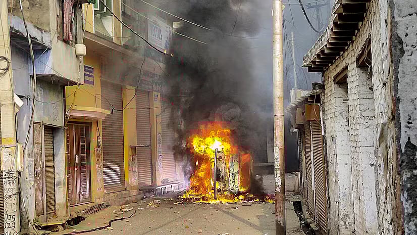 PTI : Vehicle torched during the communal clash in Uttar Pradesh's Sambhal