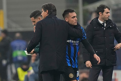 UEFA Champions League: Inter Milan's Lautaro Martinez leaving the pitch next to his coach Simone Inzaghi