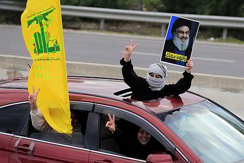 Israel Lebanon Ceasefire: A woman carries a picture of Hassan Nasrallah