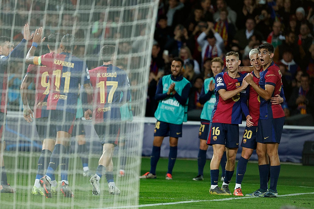 UEFA Champions League: Barcelona's Dani Olmo celebrates his side's fourth goal  - | Photo: AP/Joan Monfort