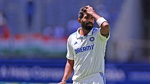AP Photo/Trevor Collens : India's captain Jasprit Bumrah gestures as he prepares to bowl on the fourth day of the first cricket test between Australia and India in Perth.
