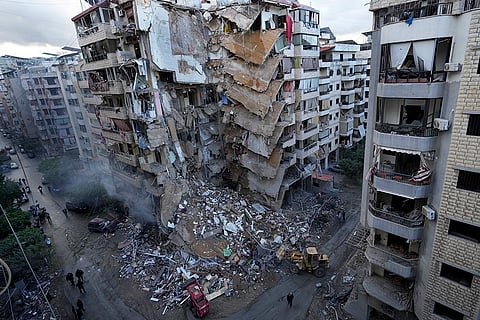 Middle East Tensions: Bulldozers remove the rubble in Beirut