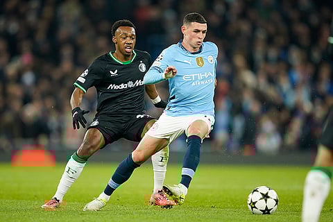 UEFA Champions League: Feyenoord's Antoni Milambo, left, challenges Manchester City's Phil Foden