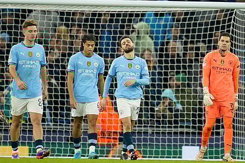 UEFA Champions League: Manchester City's Bernardo Silva, second right, reacts after Feyenoord scored their third goal