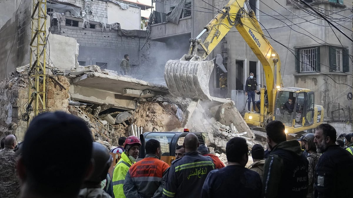 AP : Rescuers use an excavator as they search for victims at the site of an Israeli airstrike that hit a building in Beirut, Tuesday, Nov. 26, 2024. 