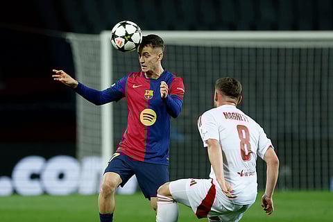UEFA Champions League: Barcelona's Ferran Torres fights for the ball against Brest's Hugo Magnetti