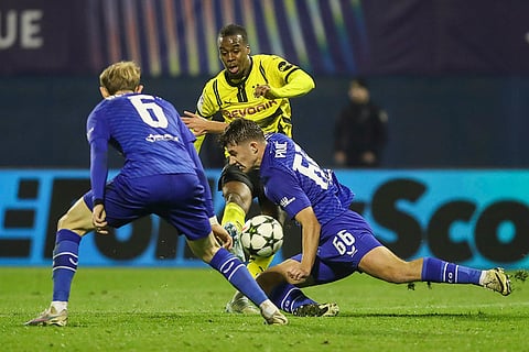 Champions League 2024-25: Dortmund's Jamie Bynoe-Gittens, centre, scores his side's opening goal