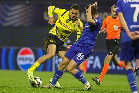 Champions League 2024-25: Dortmund's Felix Nmecha, left, is challenged by Dinamo's Branko Pavic
