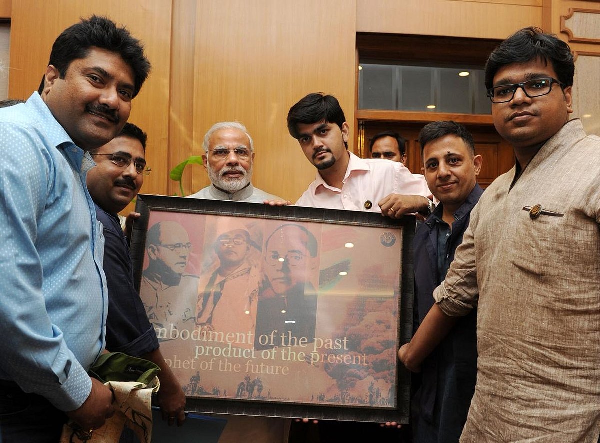 Anuj Dhar and Chandrachur Ghose with PM Modi