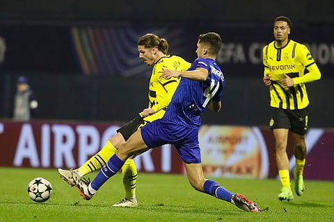 Champions League 2024-25: Dortmund's Marcel Sabitzer, left, is challenged by Dinamo's Raul Torrente