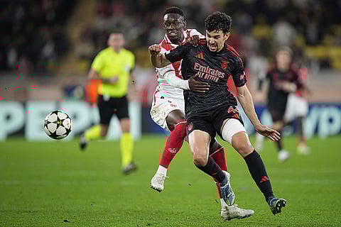 Champions League 2024-25: Benfica's Tomas Araujo, front, and Monaco's Folarin Balogun battle for the ball