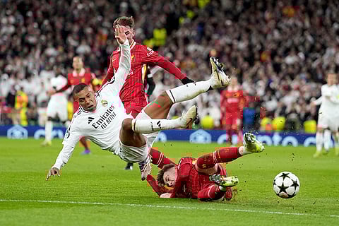Champions League 2024-25: Liverpool's Conor Bradley tackles Real Madrid's Kylian Mbappe