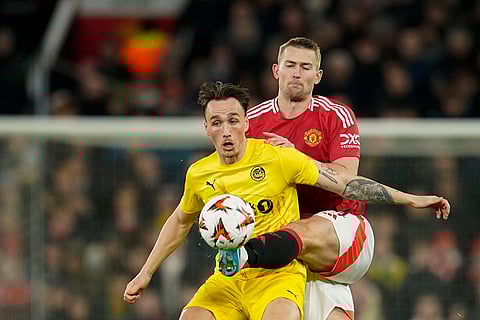 UEFA Europa League: Glimt's Andreas Helmersen, front, duels for the ball with Manchester United's Matthijs de Ligt