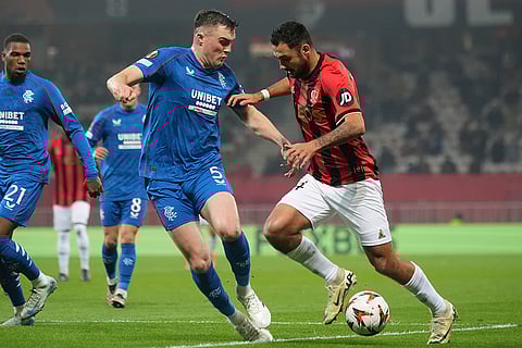 UEFA Europa League: Nice's Dante, right, and Rangers' John Souttar fight for the ball