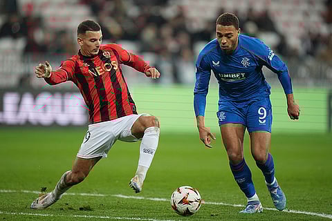 UEFA Europa League: Rangers' Cyriel Dessers, right, and Nice's Badredine Bouanani fight for the ball