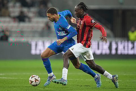 UEFA Europa League: Rangers' Cyriel Dessers, back, and Nice's Yael Nandjou fight for the ball