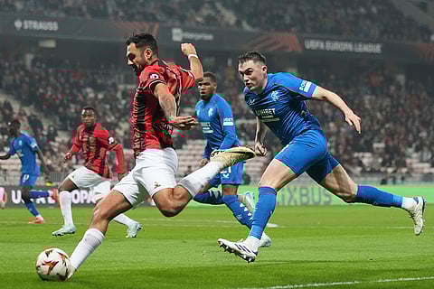 UEFA Europa League: Nice's Dante, left, kicks a ball chased by Rangers' John Souttar
