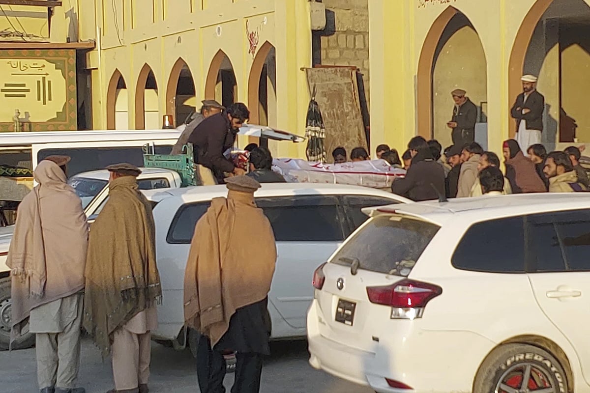AP : Relatives load body of a victim killed in firing on November 22, 2024 in Kurram |
