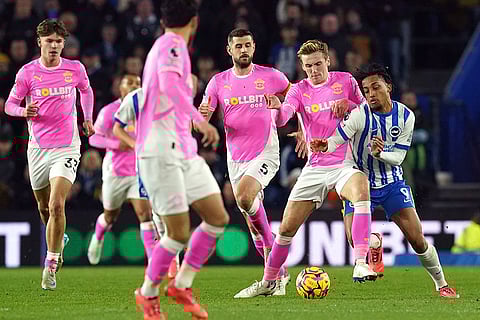 English Premier League: Southampton's Flynn Downes and Brighton's Joao Pedro, right, battle for the ball