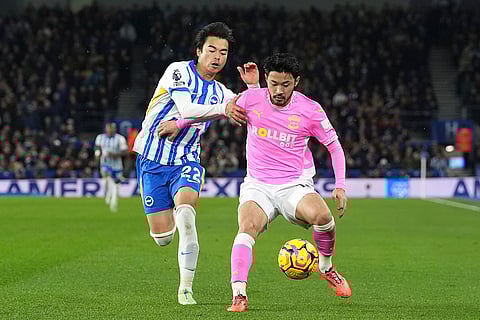 English Premier League: Brighton's Kaoru Mitoma, left, and Southampton's Yukinari Sugawara battle for the ball