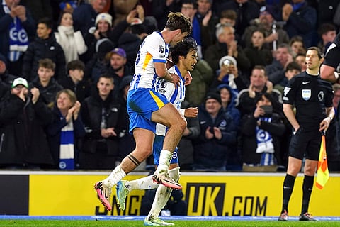 English Premier League: Brighton's Kaoru Mitoma, right, celebrates scoring