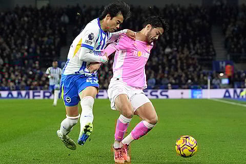 English Premier League: Brighton's Kaoru Mitoma, left, and Southampton's Yukinari Sugawara battle for the ball