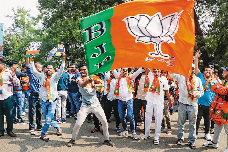 BJP supporters celebrate the party’s win in the Maharashtra Assembly election