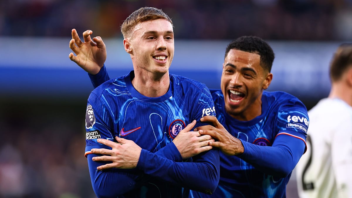 Cole Palmer celebrates scoring Chelsea's third goal