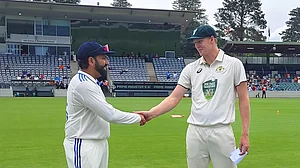 X/BCCI : Rohit Sharma with Jack Edwards during the pink ball warm-up match.