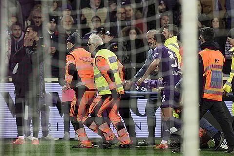 Serie A soccer: Fiorentina's Edoardo Bove, injured, is transported to a waiting ambulance