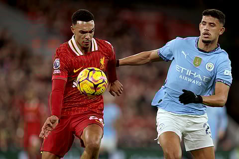 English Premier League 2024-25: Liverpool's Trent Alexander-Arnold vies for the ball with Manchester City's Matheus Nunes