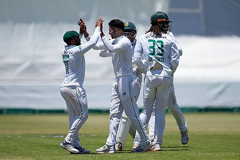 RSA Vs SL, 1st Test Day 4: South Africa's Keshav Maharaj, centre, celebrates with captain Temba Bavuma