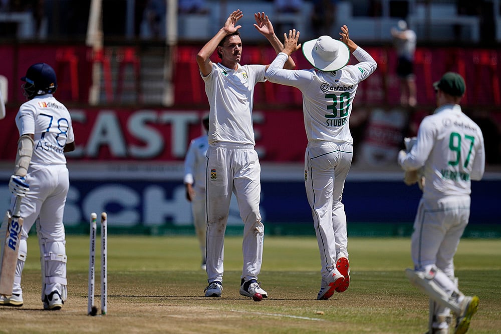 | Photo: AP/Themba Hadebe : RSA Vs SL, 1st Test Day 4: South Africa's Marco Jansen celebrates with Tristan Stubbs