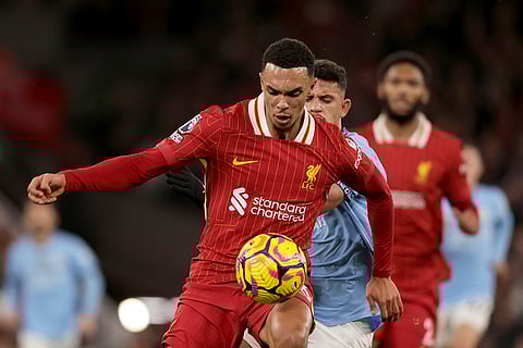 English Premier League 2024-25: Liverpool's Trent Alexander-Arnold shields the ball from Manchester City's Matheus Nunes
