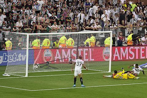 Copa Libertadores Final: Junior Santos of Botafogo, right, scores his his side's third goal