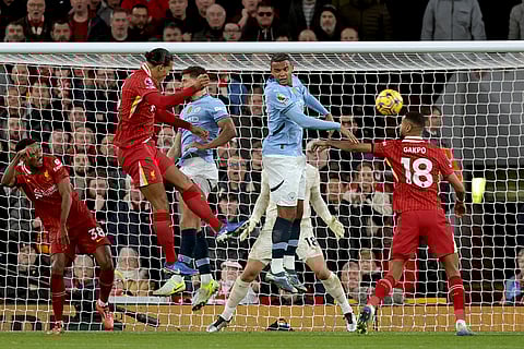 English Premier League 2024-25: Liverpool's Virgil van Dijk, 2nd left, jumps to head the ball