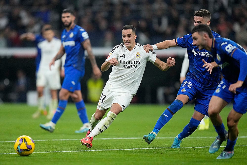 | Photo: AP/Bernat Armangue : La liga 2024-25: Real Madrid's Lucas Vazquez runs with ball ahead of Getafe's Domingos Duarte