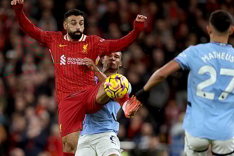 English Premier League 2024-25: Manchester City's Nathan Ake vies for the ball with Liverpool's Mohamed Salah
