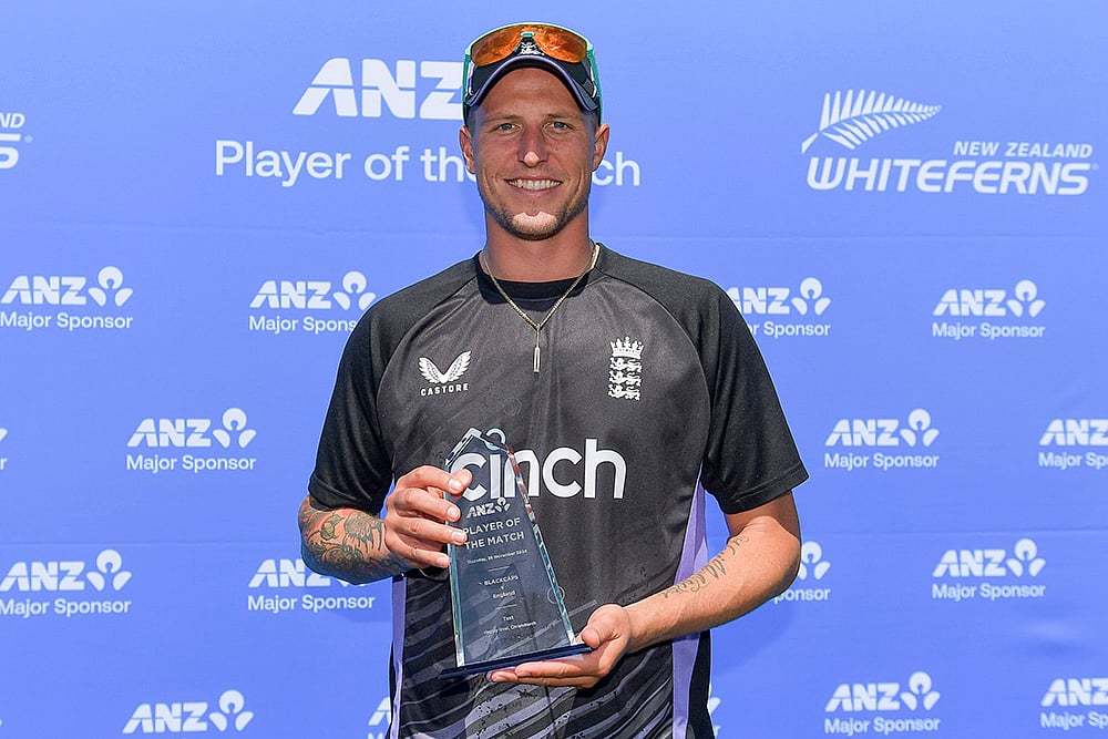 | Photo: John Davidson/Photosport via AP : NZ vs ENG 1st Test: England's Brydon Carse poses with his-man-of-the-match trophy